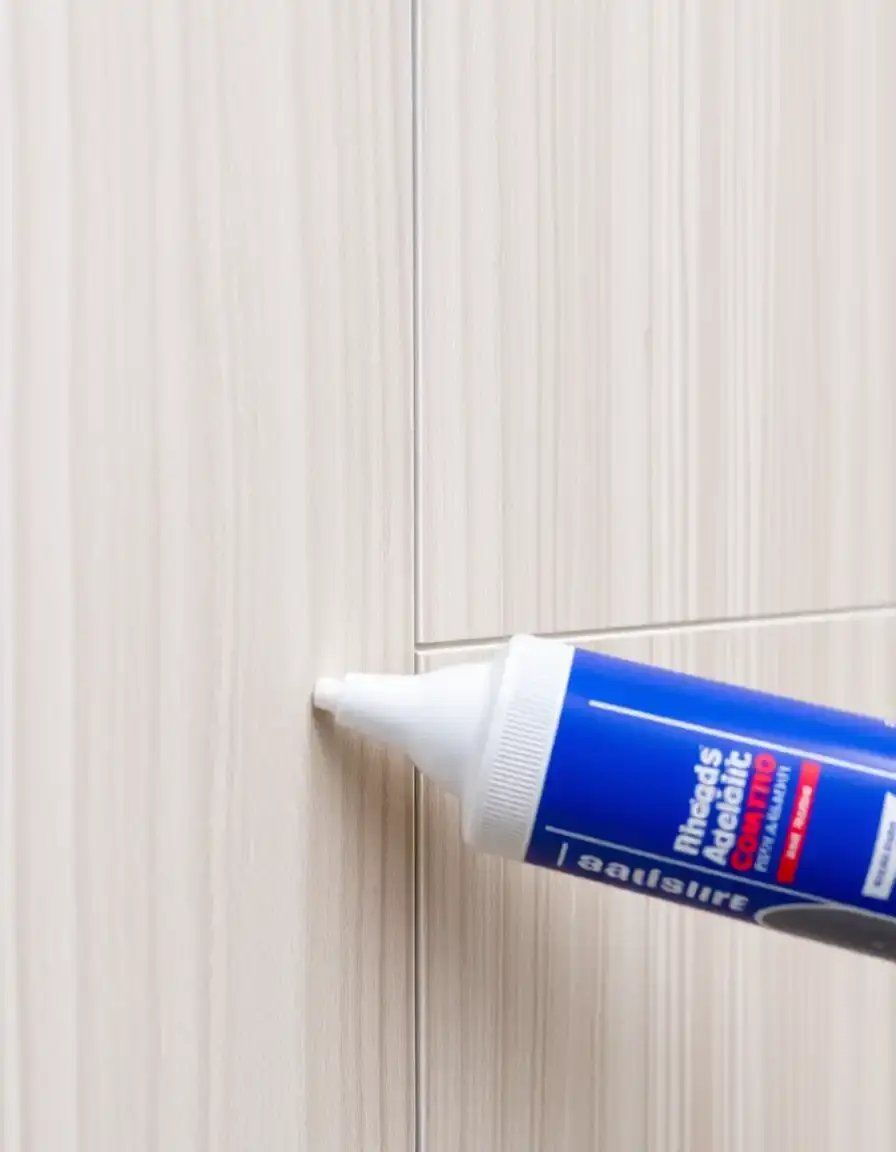 High-strength tube adhesive for wall panels