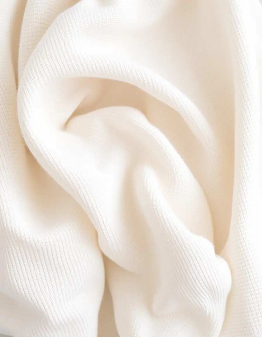Stack of soft organic cotton dish towels in neutral tones